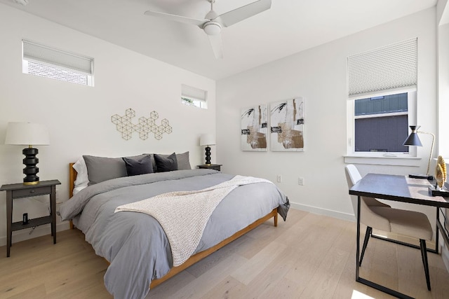 1713 E M Franklin Ave Unit 1, Austin, TX 78721 - bedroom featuring light wood finished floors, multiple windows, and a ceiling fan
