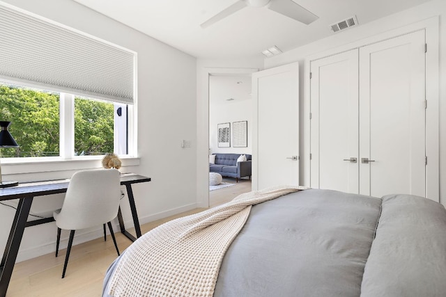 1713 E M Franklin Ave Unit 1, Austin, TX 78721 - bedroom featuring a closet, a ceiling fan, and light wood finished floors