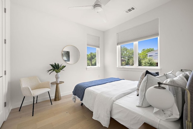 1713 E M Franklin Ave Unit 1, Austin, TX 78721 - bedroom with light wood finished floors and a ceiling fan