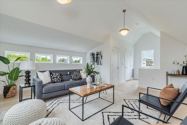 1713 E M Franklin Ave Unit 1, Austin, TX 78721 - living area featuring vaulted ceiling and wood finished floors