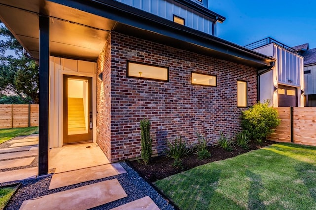 1713 E M Franklin Ave Unit 1, Austin, TX 78721 - entrance to property featuring brick siding, board and batten siding, and a garage