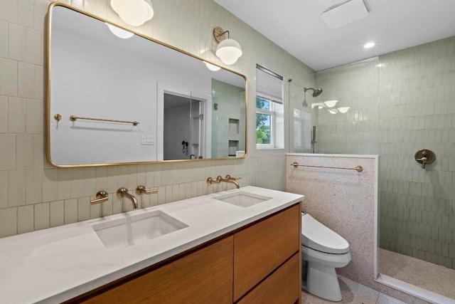1701 Brentwood St, Austin, TX 78757 - full bath featuring tile walls, a walk in shower, double vanity, and decorative backsplash