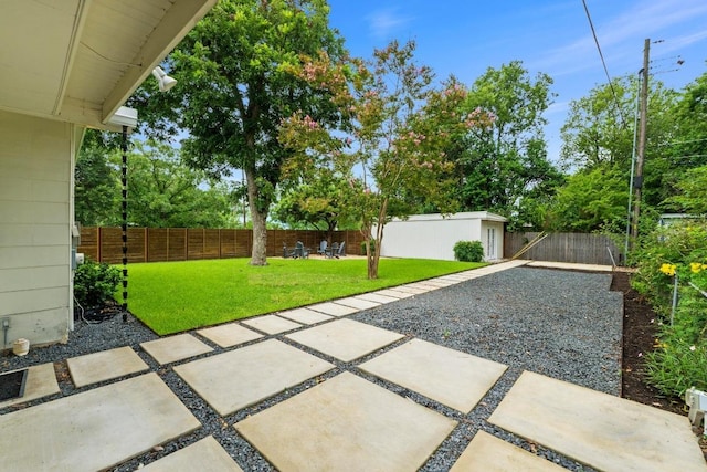 1701 Brentwood St, Austin, TX 78757 - fenced backyard with a patio area and an outdoor structure