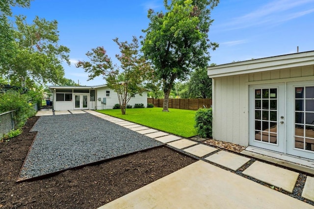 1701 Brentwood St, Austin, TX 78757 - fenced backyard featuring french doors and a patio