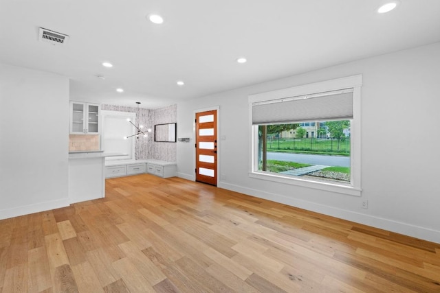 1701 Brentwood St, Austin, TX 78757 - unfurnished living room with a chandelier, recessed lighting, and light wood finished floors