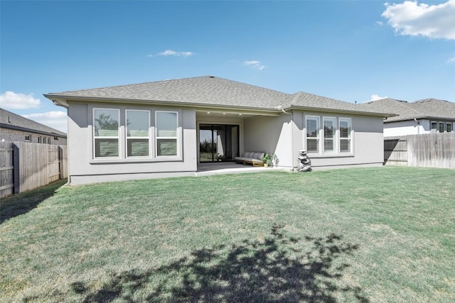807 Arrowhead Ranch Blvd, Dripping Springs, TX 78620 - rear view of house with stucco siding, a fenced backyard, and a patio