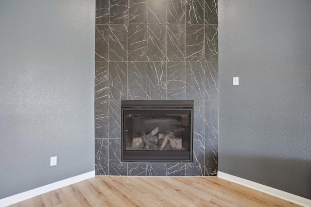807 Arrowhead Ranch Blvd, Dripping Springs, TX 78620 - detailed view of wood finished floors and a fireplace