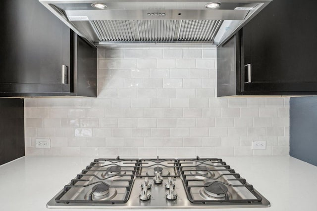 807 Arrowhead Ranch Blvd, Dripping Springs, TX 78620 - kitchen featuring stainless steel gas cooktop, wall chimney exhaust hood, light countertops, and tasteful backsplash