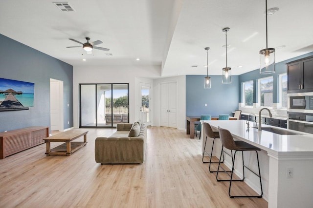 807 Arrowhead Ranch Blvd, Dripping Springs, TX 78620 - living area with light wood-type flooring, ceiling fan, and recessed lighting