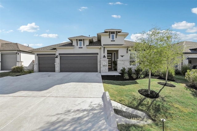 807 Arrowhead Ranch Blvd, Dripping Springs, TX 78620 - prairie-style home with stucco siding, a garage, concrete driveway, a front yard, and stone siding