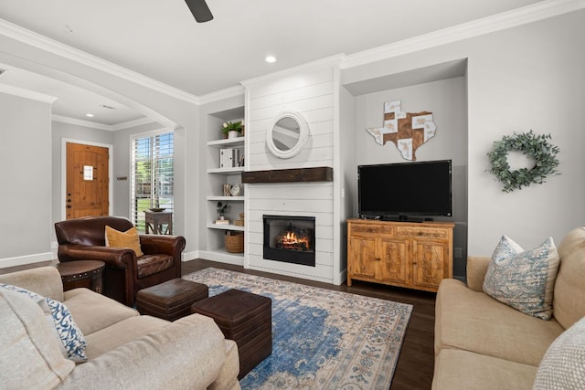 7800 SW Pkwy Unit 610, Austin, TX 78735 - living room featuring built in features, arched walkways, a large fireplace, recessed lighting, and dark wood-style flooring