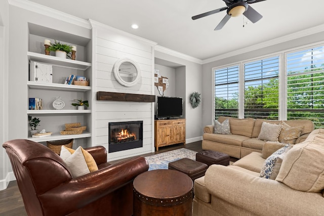 7800 SW Pkwy Unit 610, Austin, TX 78735 - living room featuring dark wood finished floors, crown molding, a ceiling fan, a large fireplace, and built in shelves