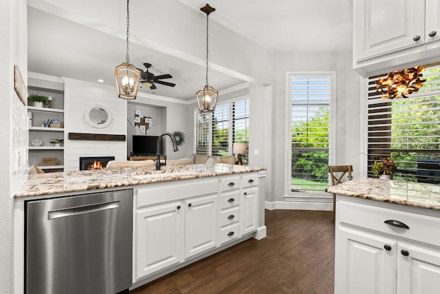 7800 SW Pkwy Unit 610, Austin, TX 78735 - kitchen featuring dishwasher, a large fireplace, dark wood finished floors, white cabinetry, and light stone countertops