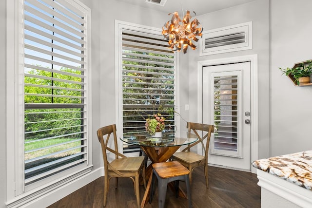 7800 SW Pkwy Unit 610, Austin, TX 78735 - dining area featuring a chandelier, dark wood-type flooring, and healthy amount of natural light