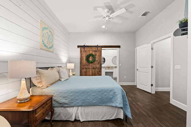 7800 SW Pkwy Unit 610, Austin, TX 78735 - bedroom with wood finished floors, a barn door, and a ceiling fan