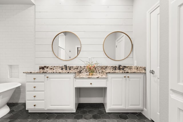 7800 SW Pkwy Unit 610, Austin, TX 78735 - bathroom featuring double vanity, a soaking tub, and tile patterned floors