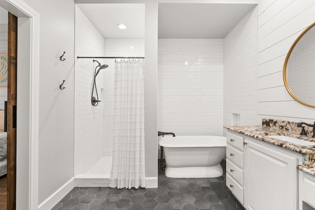 7800 SW Pkwy Unit 610, Austin, TX 78735 - bathroom featuring vanity, a freestanding bath, tile patterned floors, a tile shower, and recessed lighting