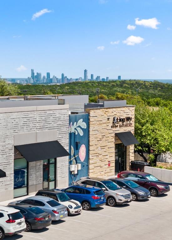 7800 SW Pkwy Unit 610, Austin, TX 78735 - view of property with uncovered parking and a view of skyline