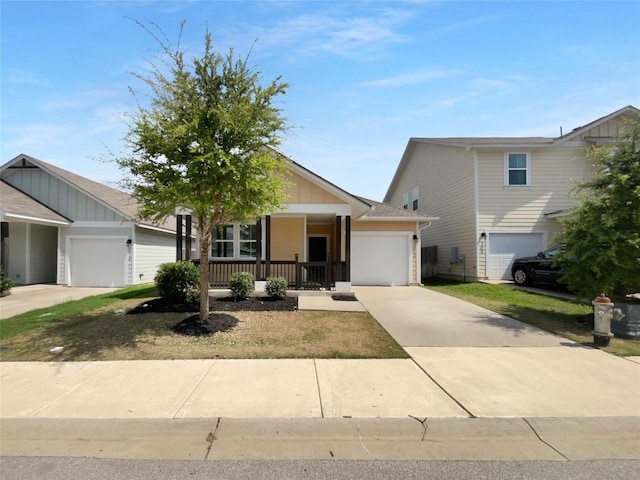312 La Escalera Dr, Leander, TX 78641 - ranch-style house with board and batten siding, a garage, and driveway
