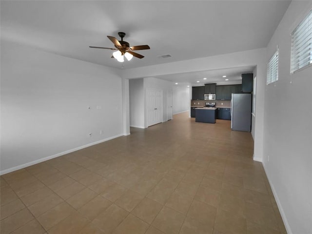 312 La Escalera Dr, Leander, TX 78641 - unfurnished living room with a ceiling fan and recessed lighting