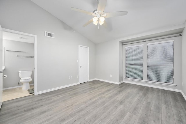 3839 Dry Creek Dr Unit 207, Austin, TX 78731 - unfurnished bedroom with vaulted ceiling, wood finished floors, connected bathroom, and ceiling fan