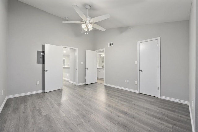 3839 Dry Creek Dr Unit 207, Austin, TX 78731 - unfurnished bedroom with ensuite bath, high vaulted ceiling, wood finished floors, a ceiling fan, and electric panel