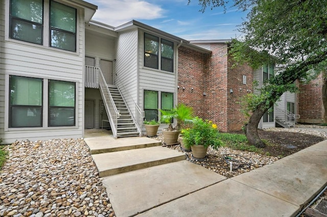 3839 Dry Creek Dr Unit 207, Austin, TX 78731 - view of building exterior featuring stairs