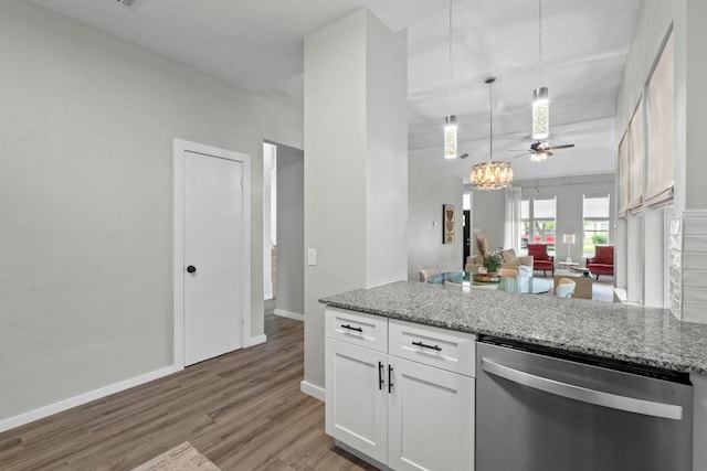 2134 Cervin Blvd, Austin, TX 78728 - kitchen featuring dishwasher, light wood finished floors, white cabinets, open floor plan, and a peninsula