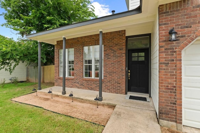 2134 Cervin Blvd, Austin, TX 78728 - doorway to property featuring brick siding and a garage