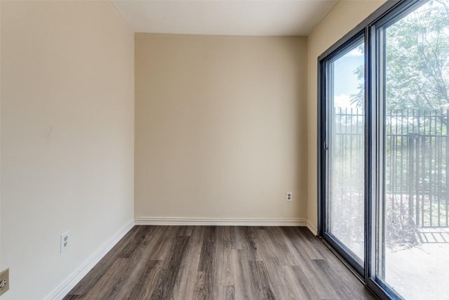 6910 Hart Ln Unit 807, Austin, TX 78731 - unfurnished room with dark wood-style floors and baseboards