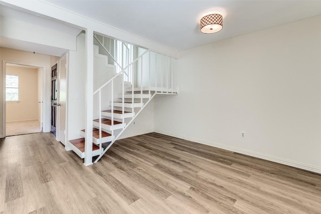 6910 Hart Ln Unit 807, Austin, TX 78731 - stairway featuring wood finished floors and baseboards