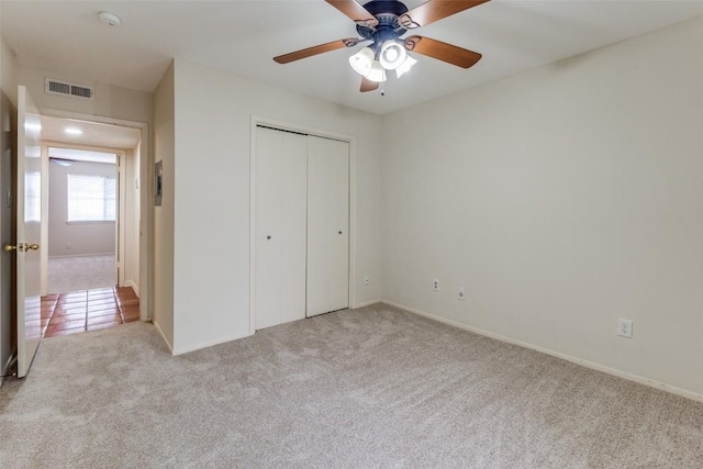 6910 Hart Ln Unit 807, Austin, TX 78731 - unfurnished bedroom featuring carpet, a closet, and a ceiling fan