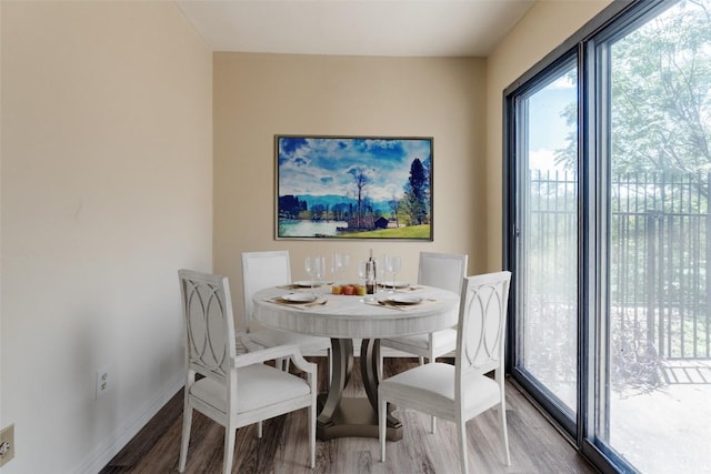 6910 Hart Ln Unit 807, Austin, TX 78731 - dining area featuring wood finished floors and baseboards
