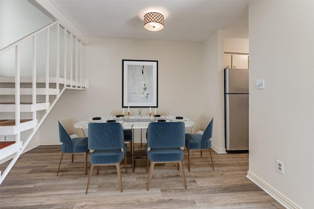 6910 Hart Ln Unit 807, Austin, TX 78731 - dining room featuring light wood-style floors and baseboards