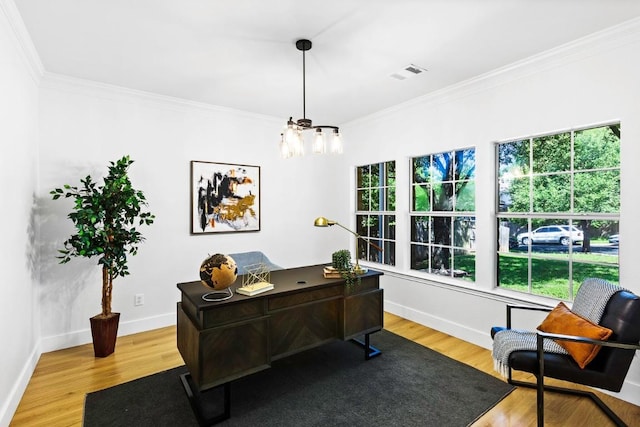 13305 Teton Ridge Cv, Austin, TX 78727 - home office featuring wood finished floors, a chandelier, and crown molding