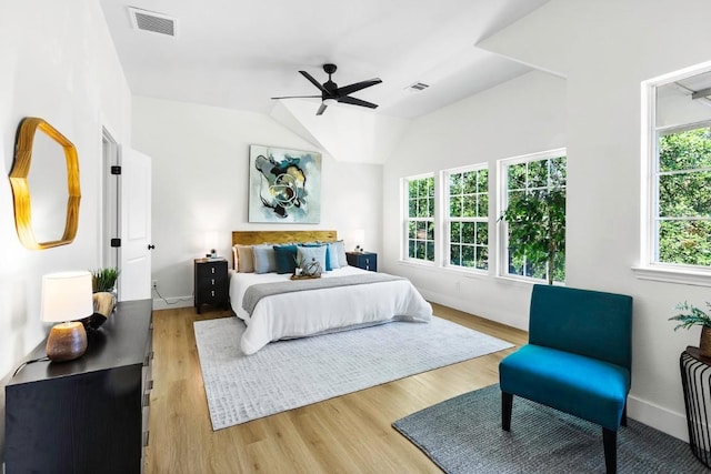 13305 Teton Ridge Cv, Austin, TX 78727 - bedroom with light wood-style flooring, vaulted ceiling, and a ceiling fan