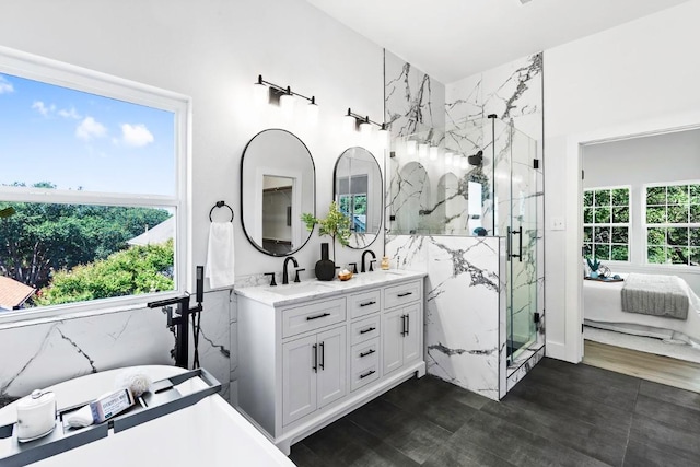 13305 Teton Ridge Cv, Austin, TX 78727 - full bathroom featuring double vanity, a marble finish shower, and a soaking tub