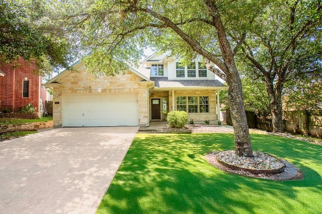 13305 Teton Ridge Cv, Austin, TX 78727 - traditional-style house featuring stone siding, driveway, and an attached garage