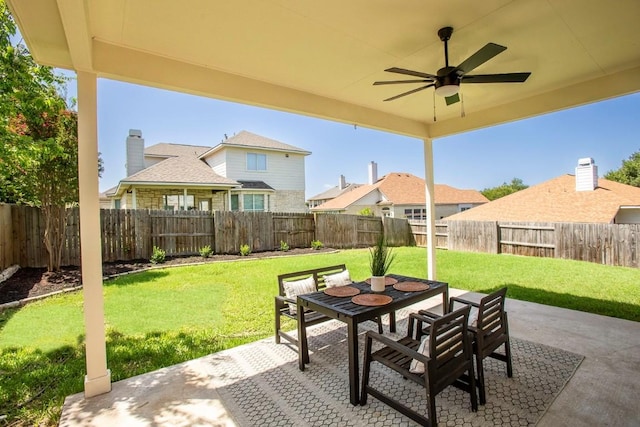 13305 Teton Ridge Cv, Austin, TX 78727 - fenced backyard with a patio area, a ceiling fan, and outdoor dining area