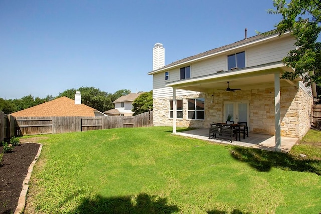 13305 Teton Ridge Cv, Austin, TX 78727 - back of property with french doors, a ceiling fan, a fenced backyard, stone siding, and a patio