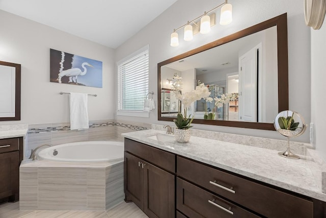 104 Atlanta Park Dr, Georgetown, TX 78628 - bathroom with vanity and a bath