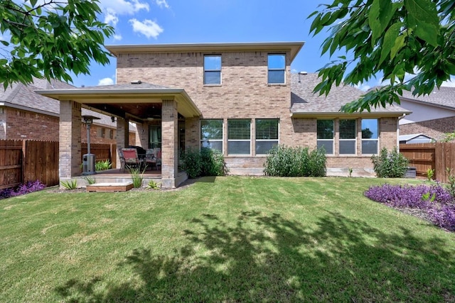 104 Atlanta Park Dr, Georgetown, TX 78628 - rear view of property with brick siding, a fenced backyard, and a patio