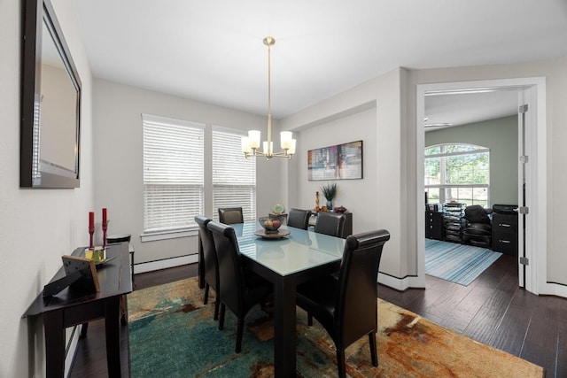 104 Atlanta Park Dr, Georgetown, TX 78628 - dining room featuring dark wood finished floors, a chandelier, and a baseboard radiator