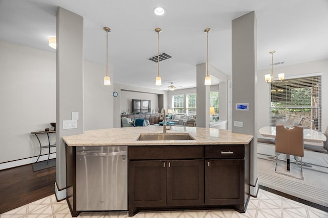 104 Atlanta Park Dr, Georgetown, TX 78628 - kitchen featuring stainless steel dishwasher, dark brown cabinets, light stone counters, pendant lighting, and open floor plan