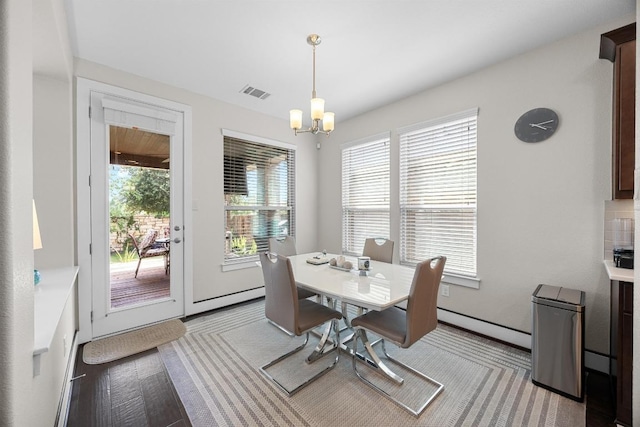 104 Atlanta Park Dr, Georgetown, TX 78628 - dining area with a chandelier, plenty of natural light, and baseboard heating