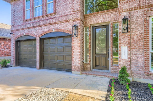 11108 Brista Way, Austin, TX 78726 - doorway to property with brick siding, driveway, and an attached garage