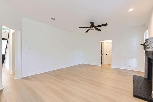 11108 Brista Way, Austin, TX 78726 - unfurnished living room featuring a fireplace, ceiling fan, light wood-style flooring, and recessed lighting