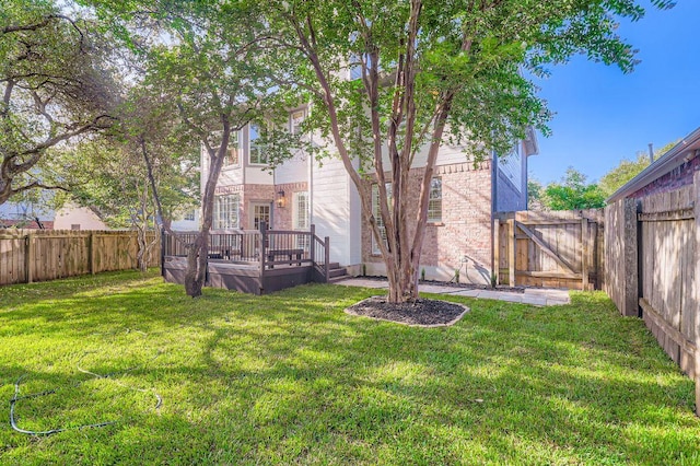 11108 Brista Way, Austin, TX 78726 - rear view of house featuring a fenced backyard, a deck, a gate, and brick siding