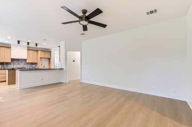 11108 Brista Way, Austin, TX 78726 - unfurnished living room with light wood-style floors, ceiling fan, and recessed lighting