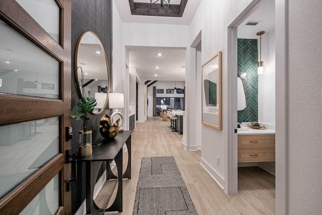 19125 Hopper Ln, Austin, TX 78738 - hallway featuring light wood-style flooring and baseboards